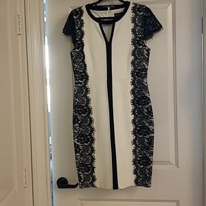 Woman short dress with lace trim on the side